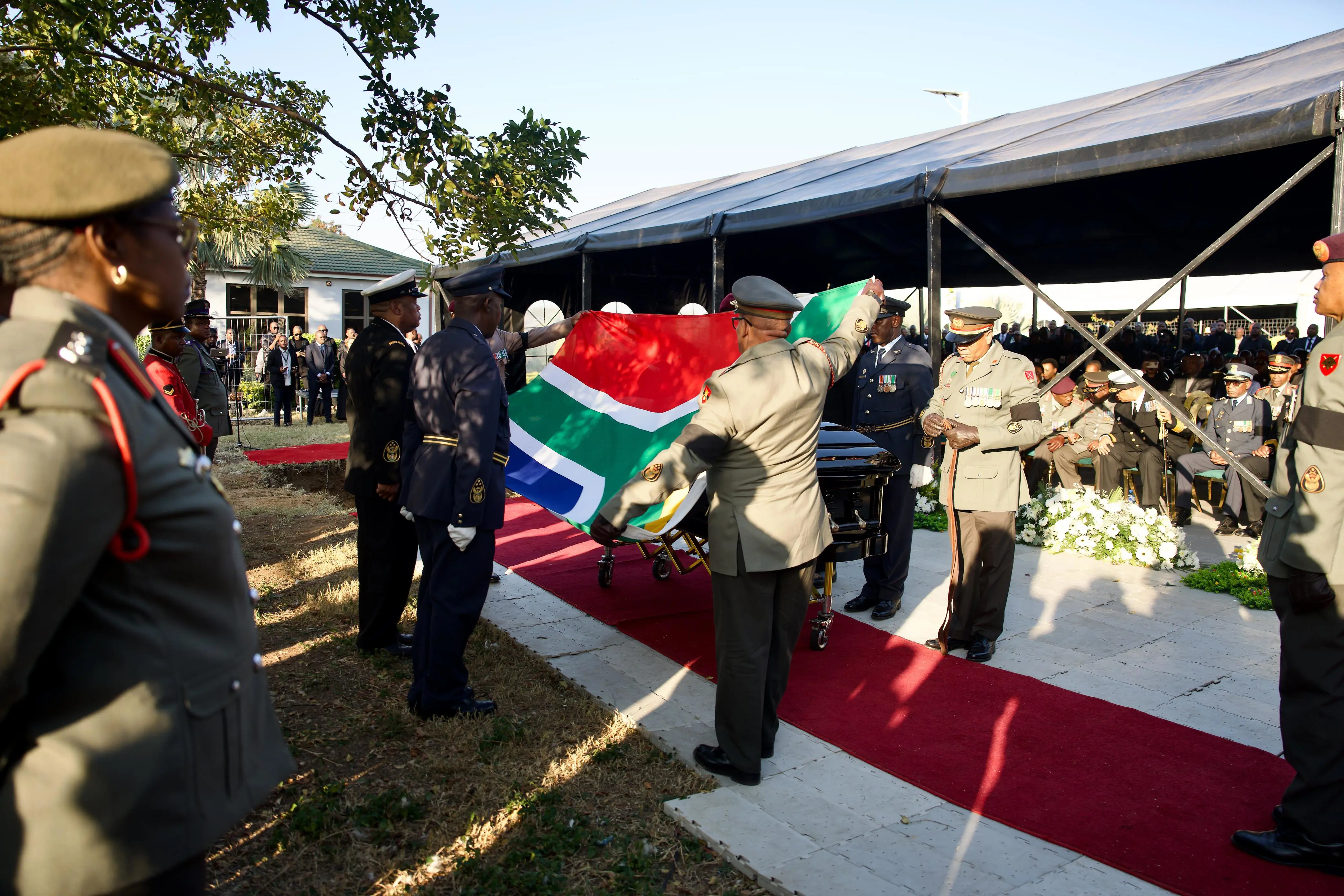 The South African flag is removed from former Deputy President David Mabuza's coffin ahead of his burial. Picture: Katlego Jiyane/EWN The South African flag is removed from former Deputy President David Mabuza's coffin ahead of his burial. Picture: Katlego Jiyane/EWN
